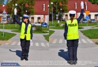 Fotografia kolorowa przedstawiająca policjantkę kierującą ruchem z podniesiona prawą ręką do góry